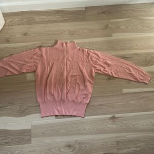 Pink ribbed turtleneck sweater
